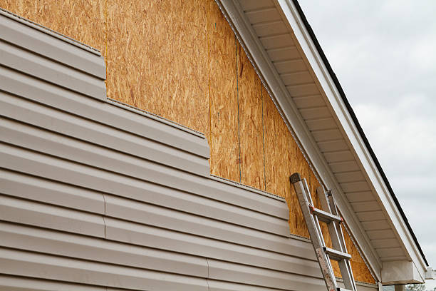 Professional Siding Installation technician working in Adah, PA
